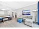 Living room with sectional sofa and large TV at 14501 Grove Resort Ave # 1430, Winter Garden, FL 34787