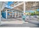 Relaxing outdoor pool bar with tables and chairs at 14501 Grove Resort Ave # 1430, Winter Garden, FL 34787