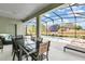 Outdoor dining area overlooking the pool and spa at 5288 Oakbourne Ave, Davenport, FL 33837