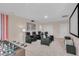 Home theater room with seating, projector, and foosball table at 5288 Oakbourne Ave, Davenport, FL 33837