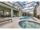 Relaxing pool and spa area with screened enclosure at 5288 Oakbourne Ave, Davenport, FL 33837