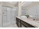 Bathroom with granite vanity and walk-in shower at 5288 Oakbourne Ave, Davenport, FL 33837