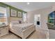 King-size bed, ensuite bathroom access, and neutral decor in this Primary bedroom at 5288 Oakbourne Ave, Davenport, FL 33837