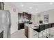 Modern kitchen with granite counters and stainless steel appliances at 5288 Oakbourne Ave, Davenport, FL 33837