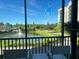 Scenic view of a lake and fountain from a screened balcony at 14501 Grove Resort Ave # 3220, Winter Garden, FL 34787