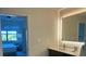 Bathroom with vanity, illuminated mirror and view of bedroom at 14501 Grove Resort Ave # 3220, Winter Garden, FL 34787