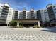 Building exterior with covered entry and attractive landscaping at 14501 Grove Resort Ave # 3220, Winter Garden, FL 34787