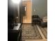 Spacious living room featuring dark hardwood floors and comfortable seating at 3115 Albert St, Orlando, FL 32806