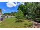 Landscaped backyard with storage shed and walkway at 3115 Albert St, Orlando, FL 32806