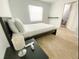 Bright bedroom with a double bed, nightstand and window at 2627 Ambergate Rd, Winter Park, FL 32792