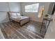 Spacious bedroom with a full-size bed, and wood-look floors at 2627 Ambergate Rd, Winter Park, FL 32792