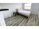 Cozy bedroom featuring a double bed, and wood-look floors at 2627 Ambergate Rd, Winter Park, FL 32792