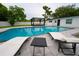 Inviting pool area with lounge chairs and pergola at 2627 Ambergate Rd, Winter Park, FL 32792