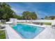 Inviting backyard oasis with a refreshing pool and patio furniture at 2627 Ambergate Rd, Winter Park, FL 32792