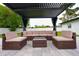 Relaxing patio area with covered seating and outdoor furniture at 2627 Ambergate Rd, Winter Park, FL 32792