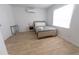 Well-lit bedroom with a full-size bed and tiled floors at 2627 Ambergate Rd, Winter Park, FL 32792