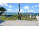 Sculptural mermaid and dolphin fountain overlooks a peaceful waterfront view at 4852 S Peninsula Dr, Ponce Inlet, FL 32127