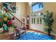 Elegant entryway with staircase, seating area, and large windows at 10980 Jim Edwards Rd, Haines City, FL 33844