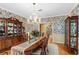 Bright dining room with a wood table, chandelier, and built-in hutch at 10980 Jim Edwards Rd, Haines City, FL 33844