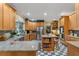 Large kitchen with granite countertops, stainless steel appliances, and wood cabinets at 10980 Jim Edwards Rd, Haines City, FL 33844