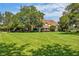 Beautiful two-story home situated on a large lot with lush landscaping at 10980 Jim Edwards Rd, Haines City, FL 33844