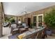 Covered patio with wicker furniture and ceiling fans at 10980 Jim Edwards Rd, Haines City, FL 33844