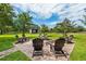 Relaxing fire pit area with brick pavers and comfortable seating at 10980 Jim Edwards Rd, Haines City, FL 33844