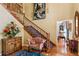Grand entry with a staircase, sitting area, and hardwood floors at 10980 Jim Edwards Rd, Haines City, FL 33844