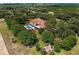 Aerial view of home with pool and lush landscaping at 10980 Jim Edwards Rd, Haines City, FL 33844