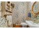 Small powder room with floral wallpaper and a pedestal sink at 10980 Jim Edwards Rd, Haines City, FL 33844