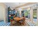 Charming breakfast nook with wood table and access to backyard at 10980 Jim Edwards Rd, Haines City, FL 33844