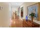 Long hallway with hardwood floors and decorative elements at 10980 Jim Edwards Rd, Haines City, FL 33844
