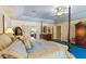 Main bedroom with a large bed and access to the bathroom at 10980 Jim Edwards Rd, Haines City, FL 33844