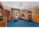 Cozy bedroom with a bunk bed, built-in desk and blue carpet at 10980 Jim Edwards Rd, Haines City, FL 33844