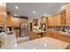 Modern kitchen featuring granite countertops and stainless steel appliances at 10980 Jim Edwards Rd, Haines City, FL 33844
