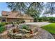 Brick home with three-car garage and landscaped side yard at 10980 Jim Edwards Rd, Haines City, FL 33844