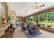Spacious screened porch with seating area overlooking the backyard at 10980 Jim Edwards Rd, Haines City, FL 33844