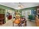 Home office with built-in shelves and view to living room at 10980 Jim Edwards Rd, Haines City, FL 33844