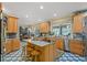 Spacious kitchen with granite countertops, wood cabinets, and an island at 10980 Jim Edwards Rd, Haines City, FL 33844