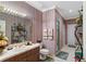 Bathroom with shower, toilet, and wood vanity at 10980 Jim Edwards Rd, Haines City, FL 33844