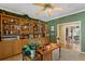 Home office with built-in wooden shelves and desk at 10980 Jim Edwards Rd, Haines City, FL 33844