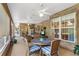 Relaxing screened porch with wicker furniture and dining area at 10980 Jim Edwards Rd, Haines City, FL 33844