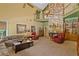 Large Gathering room with high ceilings, stone fireplace, and ample seating at 10980 Jim Edwards Rd, Haines City, FL 33844