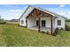 View of the home's exterior, highlighting the covered patio at 544 Waterfern Trail Dr, Auburndale, FL 33823