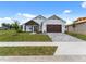 Charming craftsman style home with a two car garage at 544 Waterfern Trail Dr, Auburndale, FL 33823