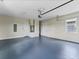 Spacious two-car garage with epoxy flooring and storage at 544 Waterfern Trail Dr, Auburndale, FL 33823