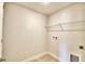 Laundry room with shelving and tile floor at 1277 Tagliamento Ln, Haines City, FL 33844