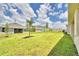 Landscaped backyard with grassy area at 1277 Tagliamento Ln, Haines City, FL 33844