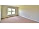 Simple bedroom with carpeted floor and large window at 1277 Tagliamento Ln, Haines City, FL 33844