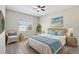 Spacious bedroom with a comfy bed and wicker furniture at 1554 Fairview Cir, Kissimmee, FL 34747